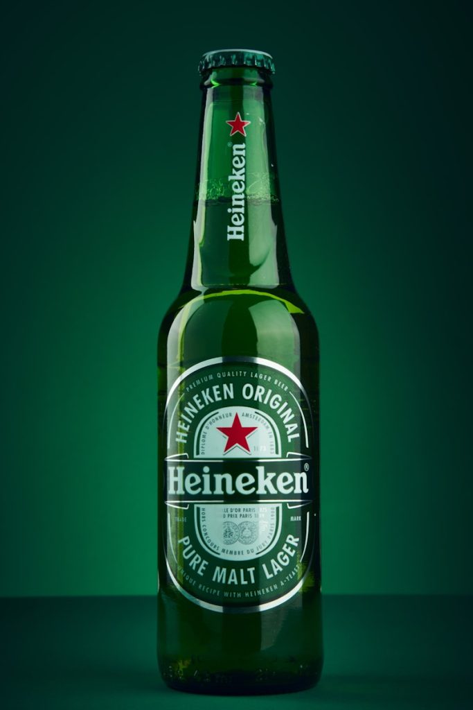 heineken beer bottle on green surface - The classic Heineken lager